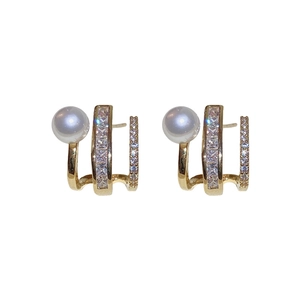 Elegant gold pearl earrings with triple C-shape wrap design and cubic zirconia stones