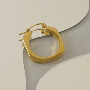 Minimalist square 18k gold plated stainless steel hoop earrings on curved background