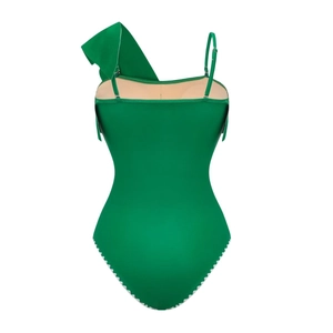 Detail of green one-piece swimsuit with ruffle shoulder and white scalloped edge trim