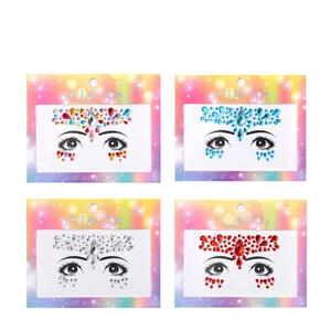 Close-up of four colored adhesive face jewel sets with teardrop rhinestones