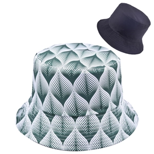 Reversible bucket hat featuring green leaf geometric pattern and solid navy lining