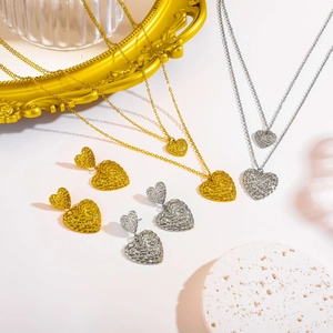 Minimalist gold and silver heart jewelry set with textured woven patterns for women