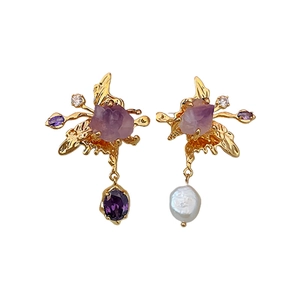 Asymmetric gold earrings with purple stones, zircon crystals, and freshwater pearl tassels