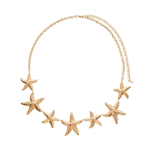 Vintage golden starfish waist chain with textured metal pendants on white background