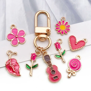 Pink enamel charms and gold keychain set for DIY jewelry making and crafting