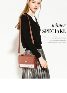 Brown retro flap handbag featuring a metal bee ornament and red heart pattern print