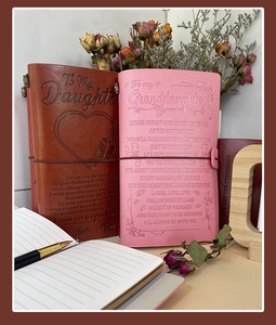 Detail of laser engraved sentimental text on premium leather A6 notebook cover