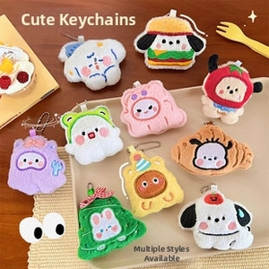 Detailed collection of assorted cute plush keychain charms on a display tray