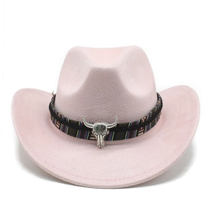 Detail of pink suede cowboy hat featuring a tribal woven band and silver bull head emblem