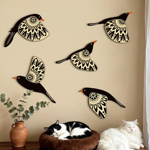 Set of 5 flying hummingbird wooden wall art pieces with geometric wing patterns