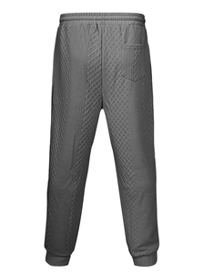 Détail du jogging gris avec tissu à texture diamant 3D et taille élastique à cordon