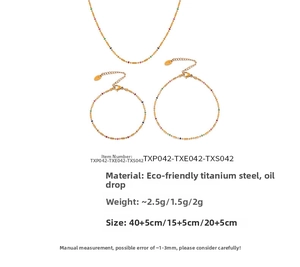 Detailed set of gold titanium steel jewelry featuring colorful drip oil beads and chain lengths