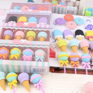 Detail of dessert-shaped erasers in a gift box with macaron colors and clear window