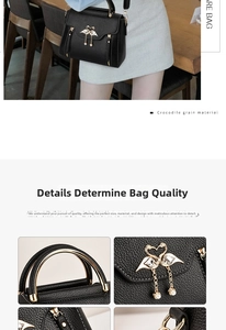 Close-up of black crocodile grain leather bag with swan buckle and pearl tassel details