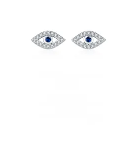 Macro detail of S925 silver evil eye stud earrings with white zircons and blue sapphire