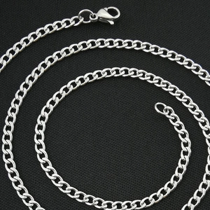 Sleek stainless steel flat Cuban link necklace with lobster clasp on black fabric