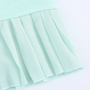 Mint green tweed sleeveless dress with pleated chiffon hem and patchwork detail