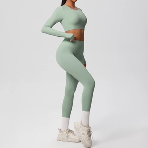 Detail view of sage green yoga set with thumbhole sleeves and high-waisted leggings