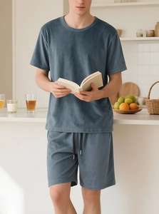Detailed close-up of men's lounge set in soft blue fleece with short sleeves and shorts