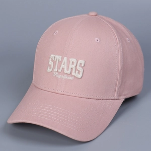 Detailed view of pink baseball cap featuring white 3D STARS and Magnificent embroidery