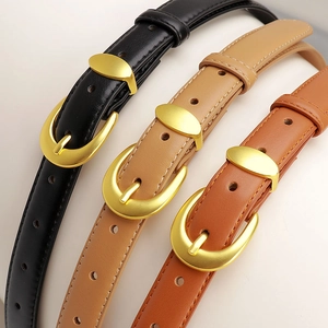 Three leather belts for women in black, khaki, and brown with gold oval pin buckles