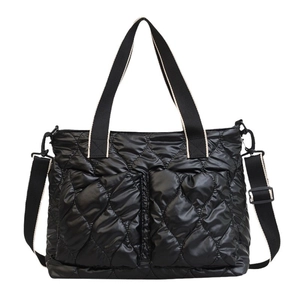 Quilted black puffer crossbody bag with top handles and adjustable strap in glossy nylon