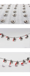 Detailed view of polished bean earrings in high-gloss silver with non-slip backings
