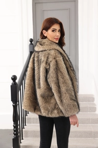 Close-up of fluffy faux fur texture and gradient brown finish on women's winter coat
