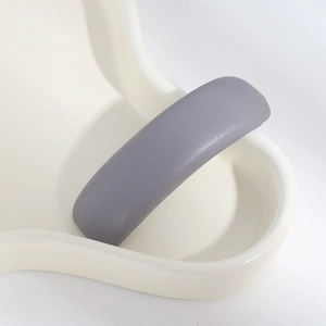 Detailed macro view of gray purple pleated PU leather texture on the elegant hairpin