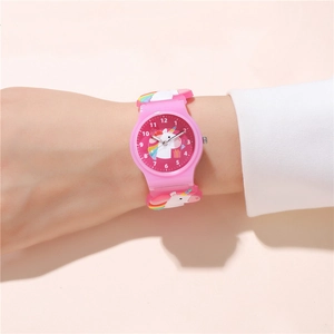 Pink kids quartz watch featuring unicorn strap patterns worn on a child's wrist
