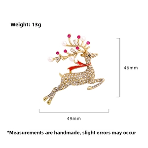 Detailed view of rhinestone reindeer brooch with pearls and enamel scarf, 46mm height
