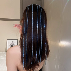 Detail of blue rhinestone tassel hair chain on model showing sparkling long fringe design
