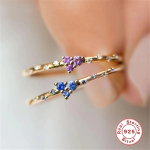 Close-up of S925 sterling silver rings with heart-shaped turquoise and pavé stones