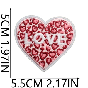 Detail view of heart embroidery patch with pink leopard print and LOVE text logo