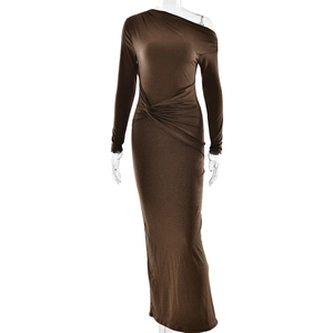 Detail of dark brown off-shoulder dress featuring metallic fabric and waist twist detail