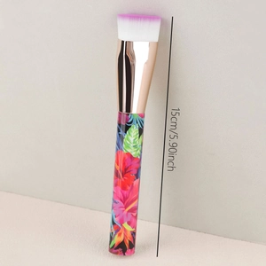 Detailed view of foundation brush with gradient bristles and tropical floral handle