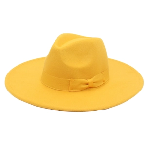 Close-up of yellow wool felt fedora featuring a matching ribbon and bow detail