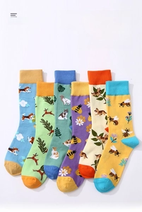 Detailed flat lay of six pairs of cotton tube socks with colorful animal embroidery