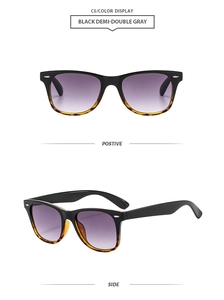 Detail view of square sunglasses with black demi frames and purple gradient lenses