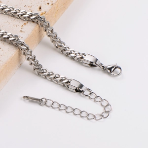 Minimalist stainless steel chain bracelet with lobster clasp and extender on stone