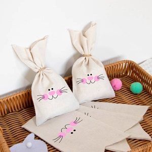 Close-up of Easter linen bunny gift bag with long ears in a woven basket