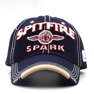 Close-up of vintage navy cotton baseball cap with SPARK 3D embroidery and white stitching