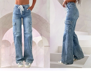 Detail of high waist light blue cargo jeans showing side pockets and drawstring waist
