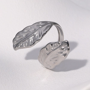 Detailed view of silver leaf ring with intricate vein textures and adjustable open band