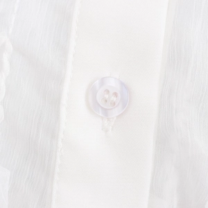 Elegant white lapel shirt for women with fringe design and detailed shell-style buttons