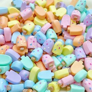 Close-up of colorful mini resin ice cream charms for DIY nail art and jewelry making