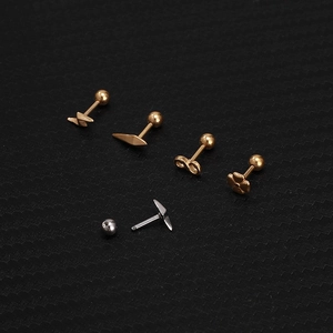 Detail of stainless steel screw back earrings with lightning and clover shapes