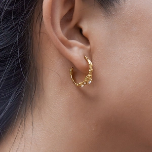 Luxurious 18K gold plated C-shape earrings with lava texture and white zircons