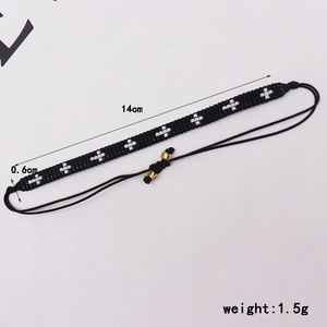 Detail view of black Miyuki bead bracelet with white cross pattern and size annotations