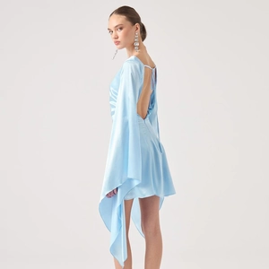 Detail view of light blue satin dress featuring an elegant backless design and long sleeves